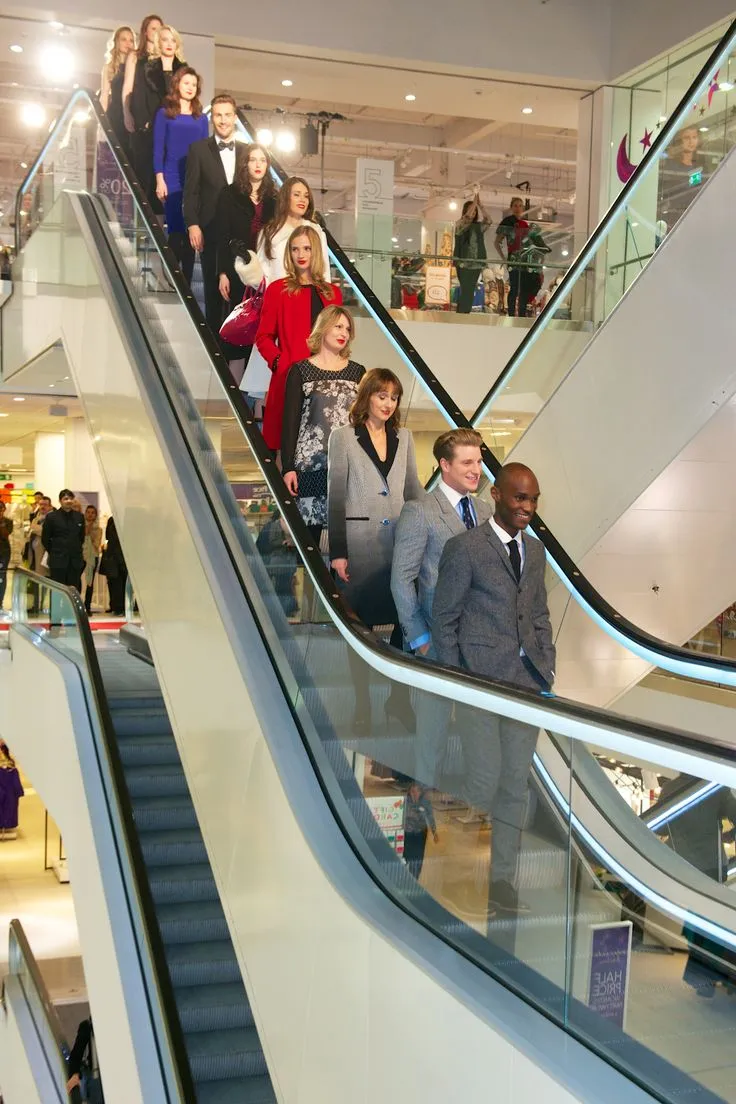 The models make their way down the escalator DebsOxfordStreet FabulousFortnight