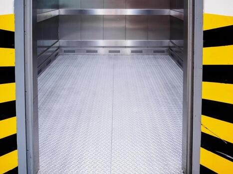 modern-elevator-with-open-door-photo